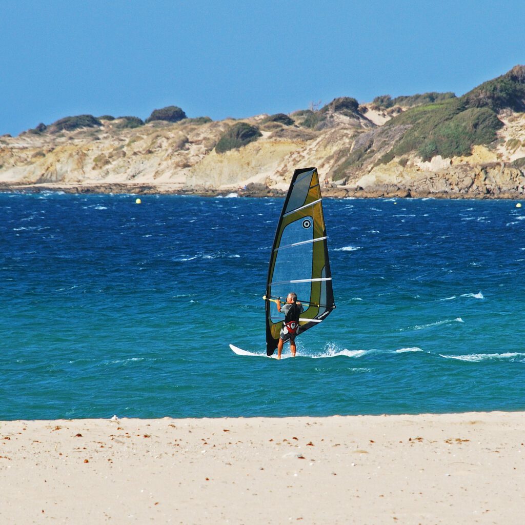 Man windsurfing off Valdevaqueros beach, Tarifa